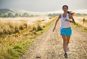 women running through fields