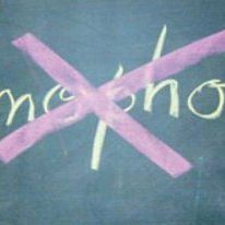 homophobia written on a blackboard