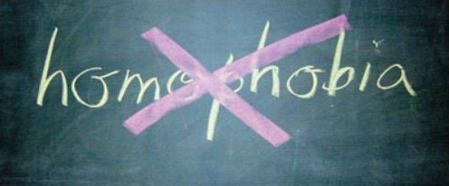 homophobia written on a blackboard