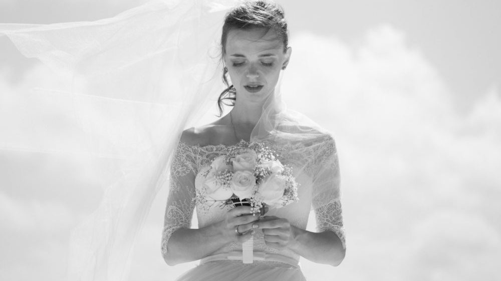 bride holding flowers