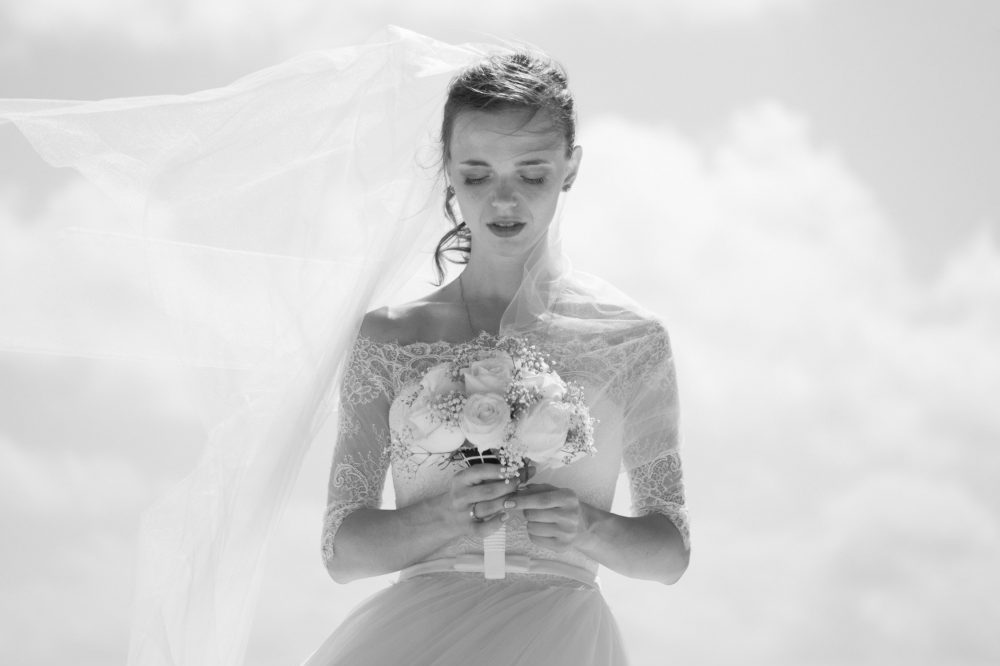 bride holding flowers