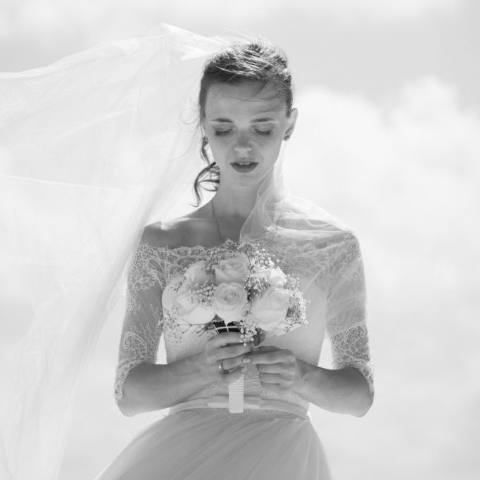 bride holding flowers