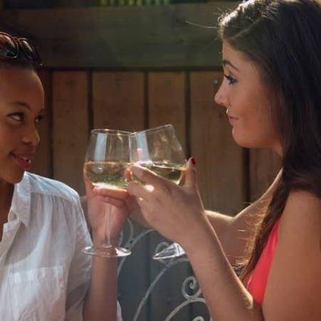 2 women drinking wine