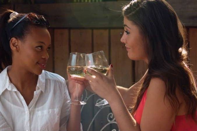 2 women drinking wine