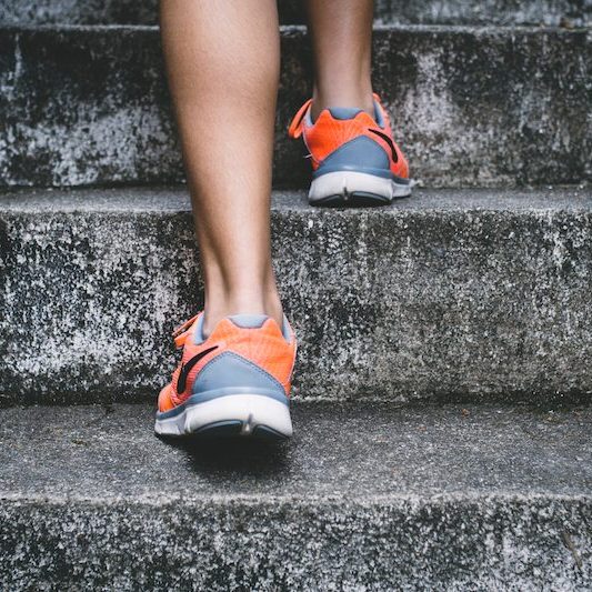 runners feet running up stairs