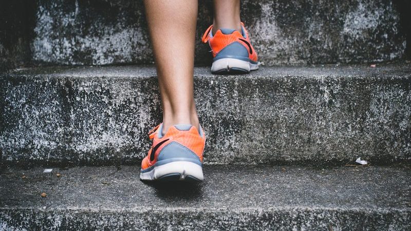 runners feet running up stairs