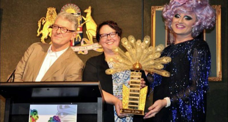 Penny Sharpe (m) holding The GLORIA Award 