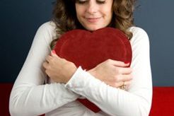 woman hugging cushion