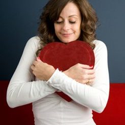 woman hugging cushion