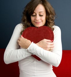 woman hugging cushion 
