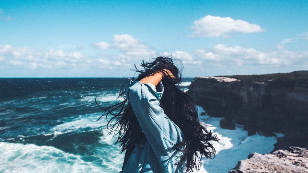 woman looking out to the ocean