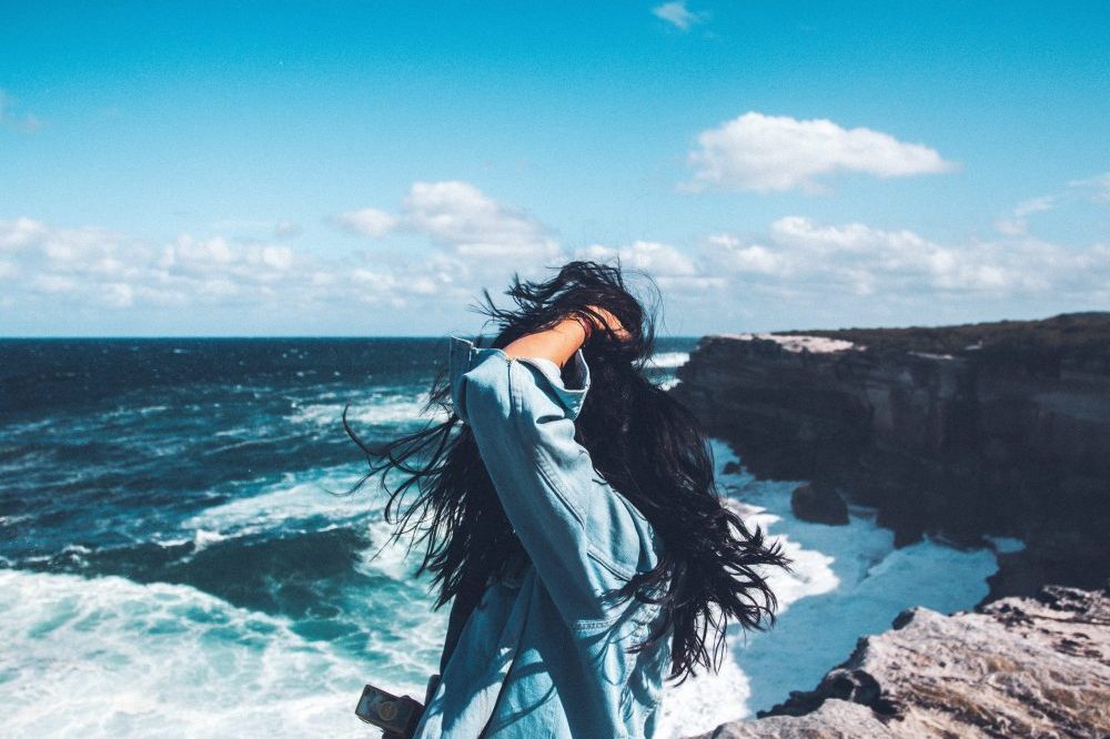 woman looking out to the ocean