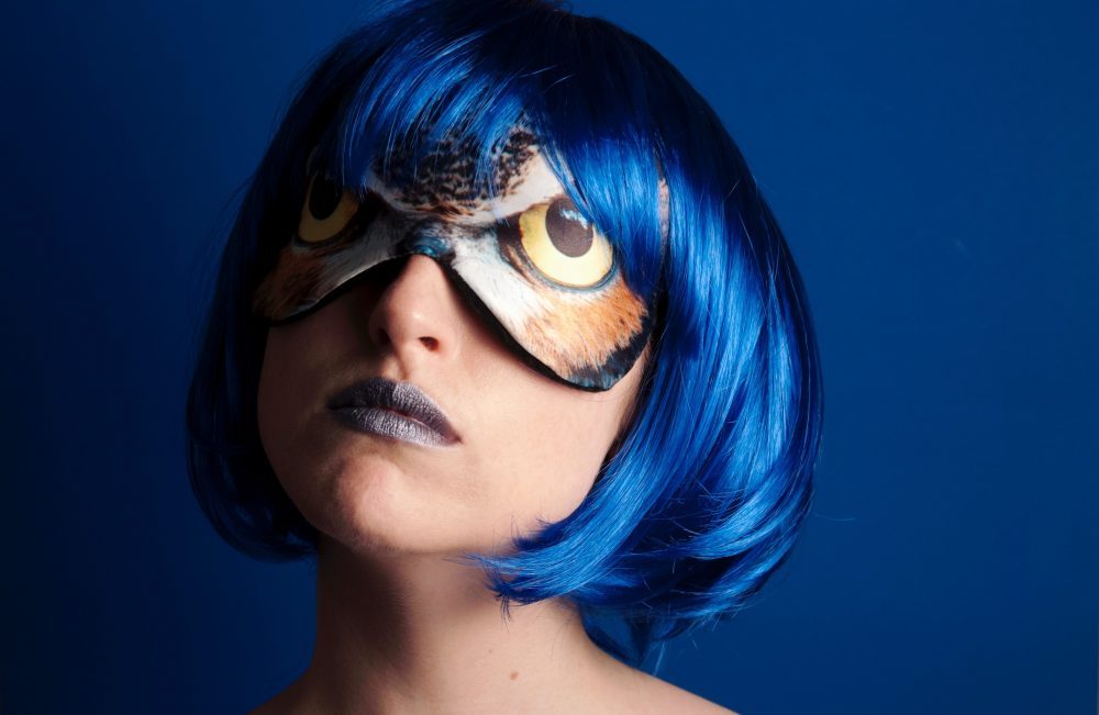 woman with blue hair and mask