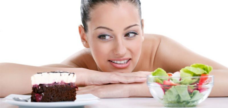 woman looking at cake 